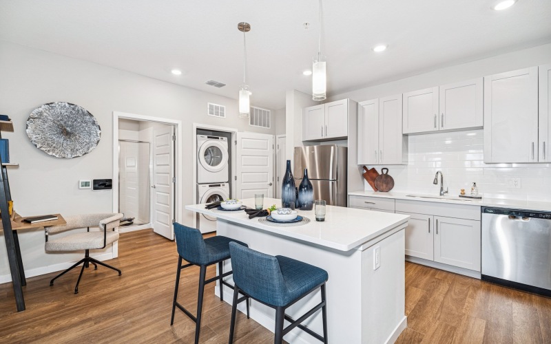 kitchen with an island with barstools