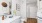 a bathroom with white counters a sink a toilet and a mirror