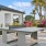 a white ping pong table in a garden
