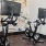 a couple of exercise bikes in a room