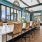 a large bar with barstools and white counters